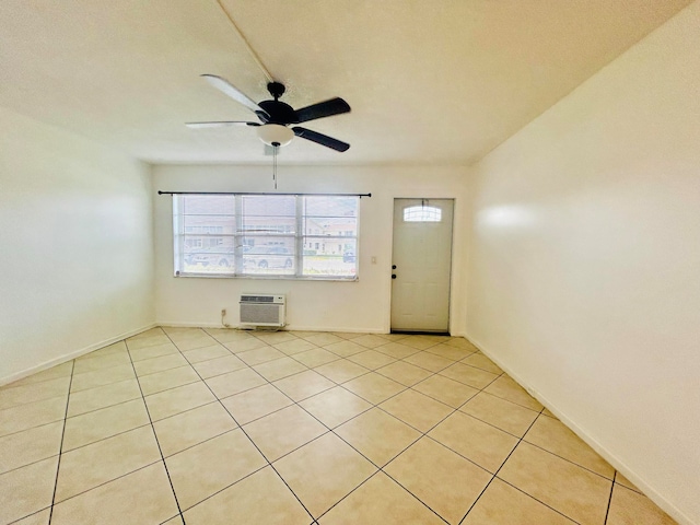 interior space featuring an AC wall unit and ceiling fan