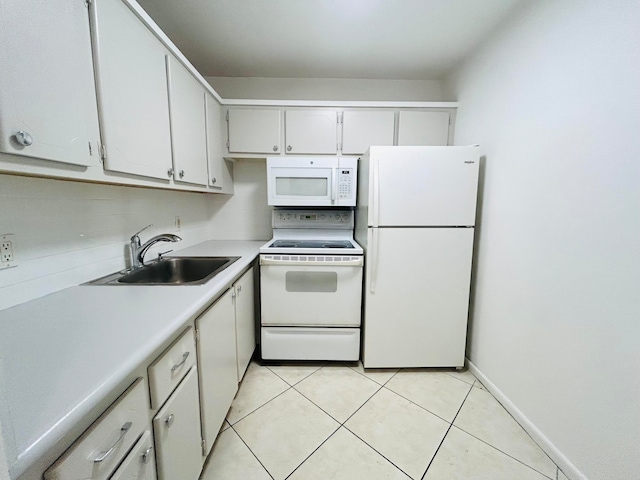 kitchen with white cabinetry, white appliances, sink, and light tile patterned floors