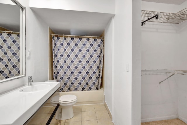 full bathroom featuring tile patterned flooring, toilet, shower / bath combo, and vanity