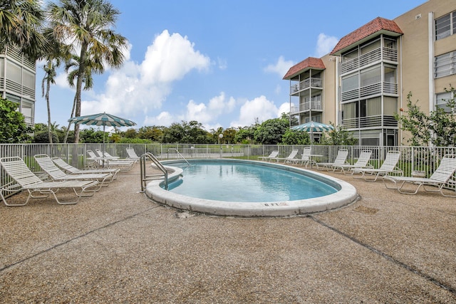 view of swimming pool featuring a patio