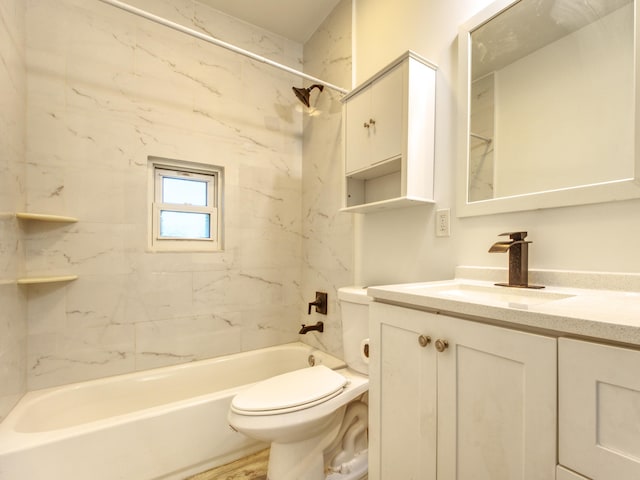 bathroom with shower / bathing tub combination, vanity, and toilet