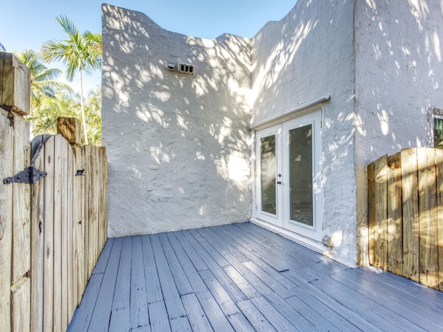 wooden deck featuring a gate