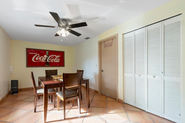 dining space featuring ceiling fan and light tile patterned floors