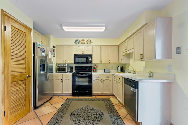 kitchen with light brown cabinets, light tile patterned flooring, sink, and black appliances