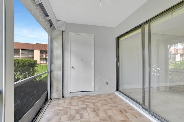 unfurnished sunroom featuring plenty of natural light