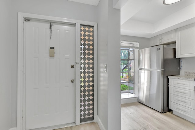 doorway to outside with light hardwood / wood-style flooring