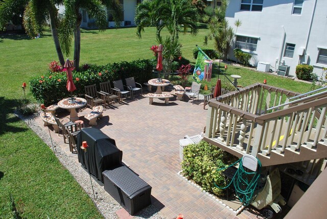 view of patio / terrace with an outdoor fire pit and a playground