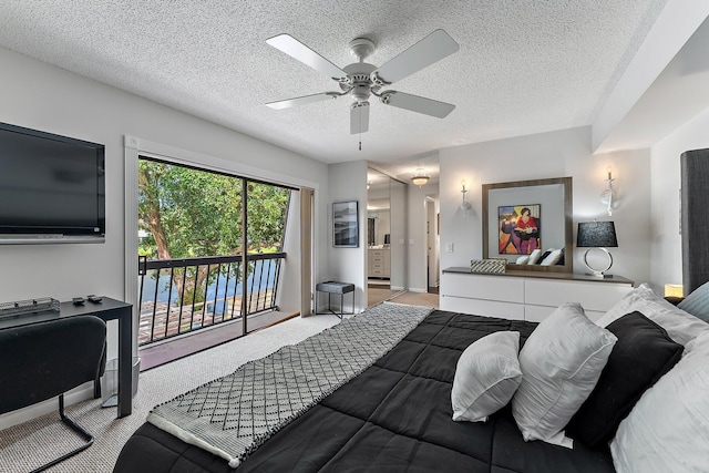 411 4th Ter, Palm Beach Gardens, FL 33418 - carpeted bedroom with access to outside, a textured ceiling, ceiling fan, and ensuite bathroom