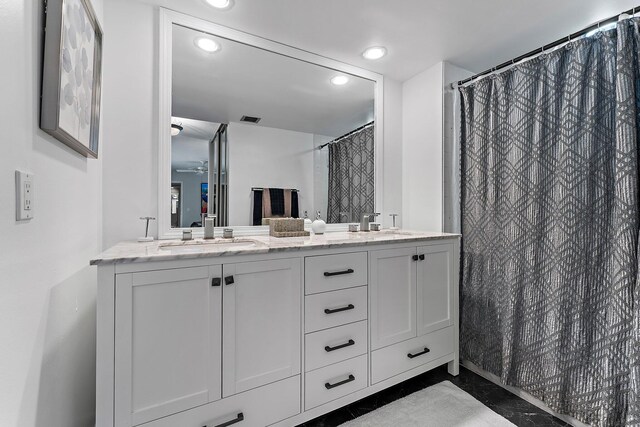 411 4th Ter, Palm Beach Gardens, FL 33418 - full bath with recessed lighting, a ceiling fan, double vanity, and a shower with curtain