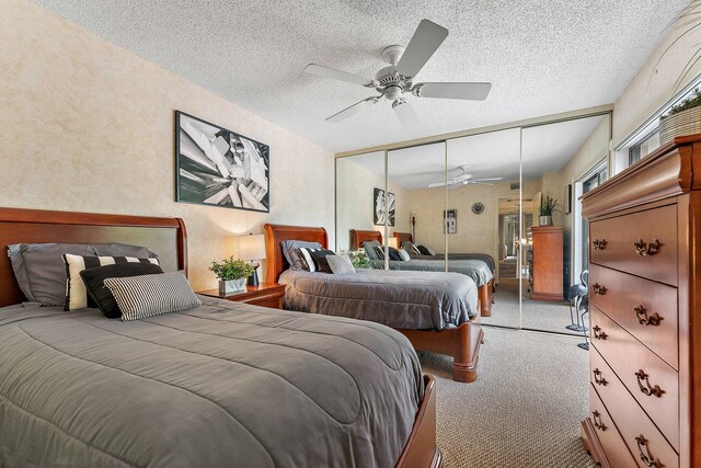 411 4th Ter, Palm Beach Gardens, FL 33418 - bedroom with carpet, a closet, a textured ceiling, a ceiling fan, and a textured wall