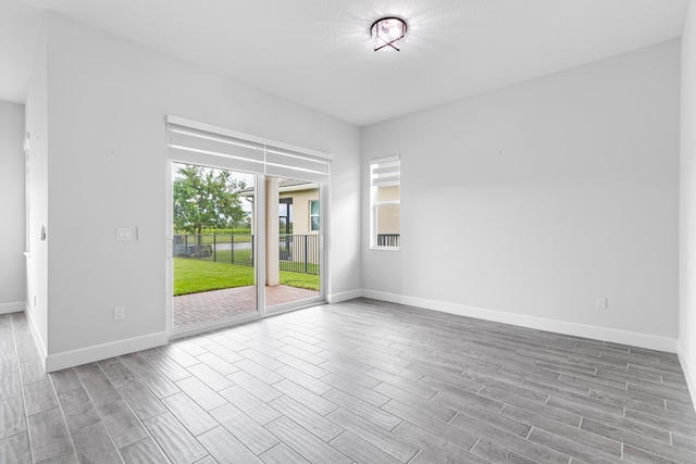 unfurnished room with light hardwood / wood-style floors