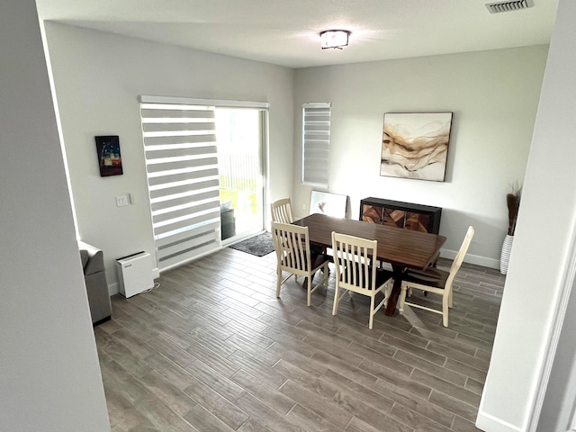 dining space featuring hardwood / wood-style flooring