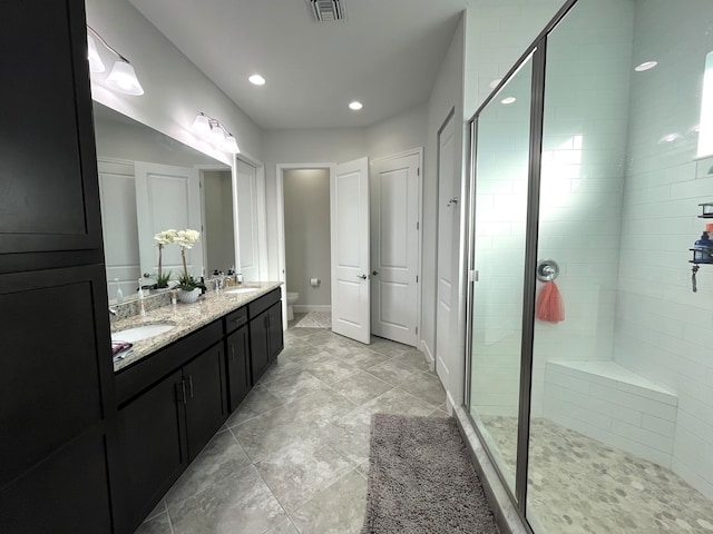 bathroom with vanity, a shower with shower door, and toilet