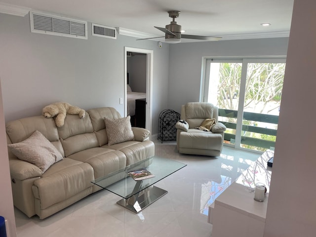 living room with ceiling fan and crown molding