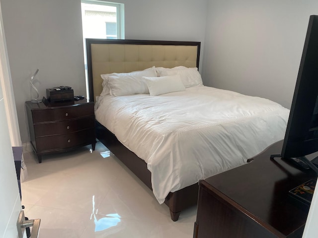 bedroom featuring light tile patterned floors