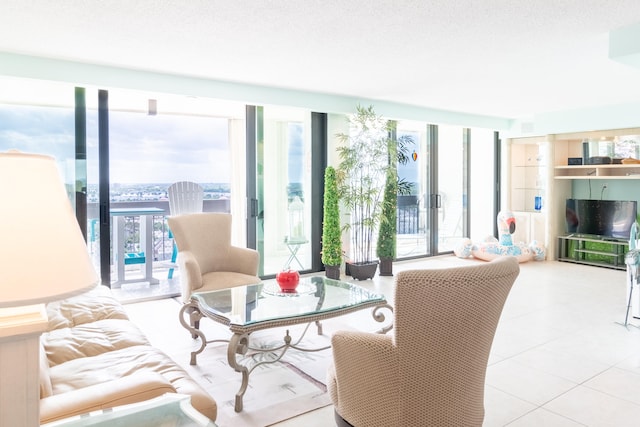 tiled living room featuring a textured ceiling, french doors, and expansive windows