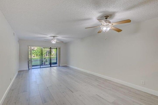 unfurnished room featuring ceiling fan, a textured ceiling, and light hardwood / wood-style floors