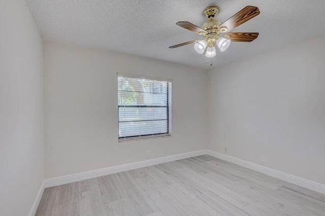 unfurnished room featuring ceiling fan, a textured ceiling, and light hardwood / wood-style flooring