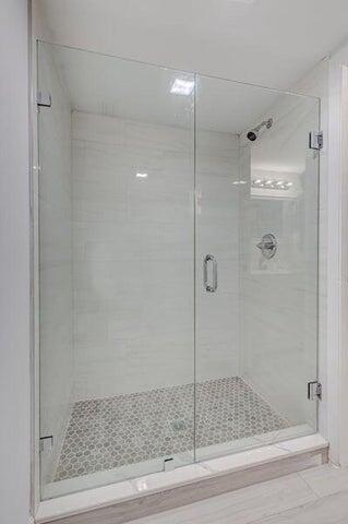 bathroom featuring walk in shower