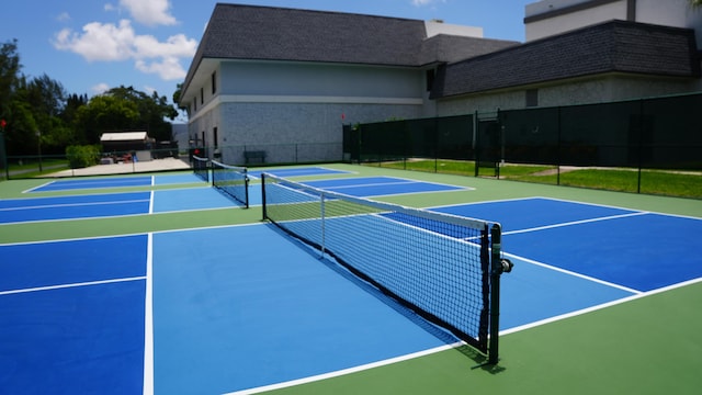 view of sport court with basketball hoop