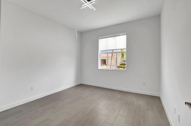 spare room with light wood-type flooring