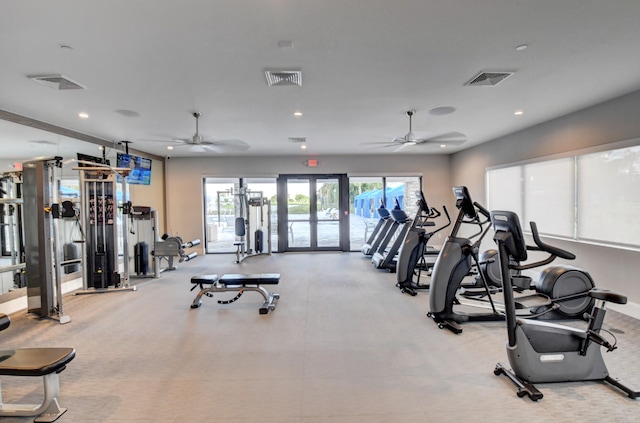 workout area with ceiling fan and french doors