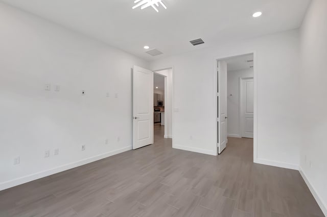 unfurnished bedroom with wood-type flooring