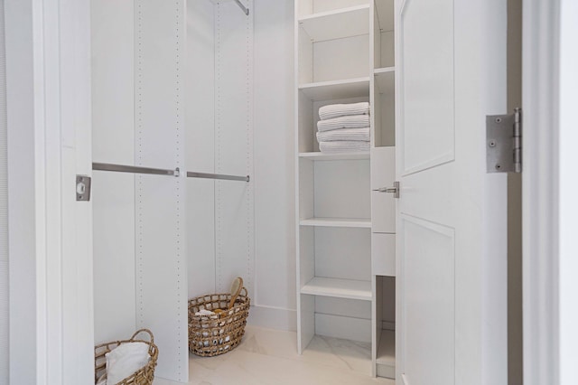 spacious closet with tile patterned flooring