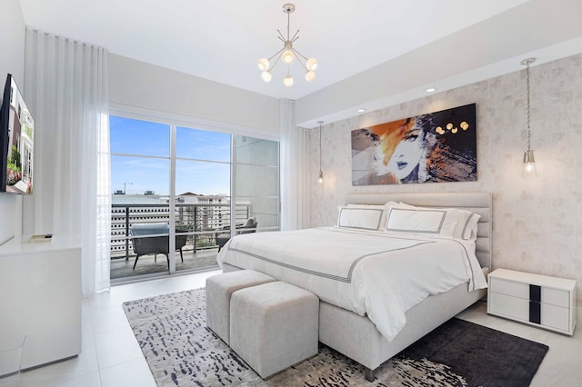 bedroom with access to outside and an inviting chandelier