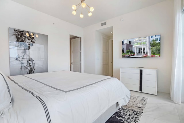 bedroom featuring a chandelier