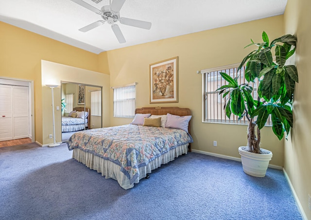 bedroom featuring ceiling fan and carpet