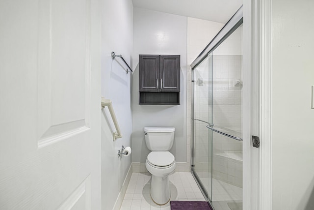 bathroom with toilet, an enclosed shower, and tile patterned floors