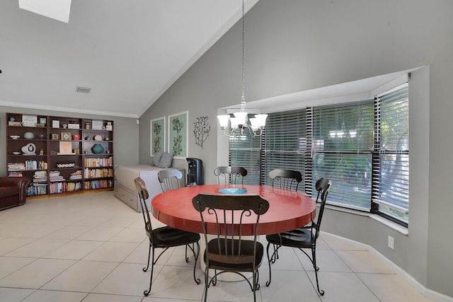 dining space featuring light tile patterned floors, crown molding, high vaulted ceiling, and a chandelier