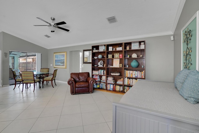 living room featuring light tile patterned flooring, ceiling fan, ornamental molding, and vaulted ceiling