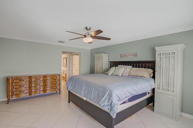 bedroom featuring light tile patterned flooring, a textured ceiling, and crown molding