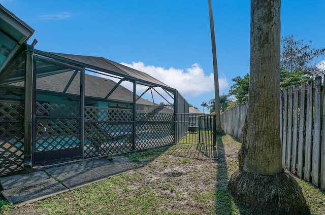 view of yard featuring a lanai