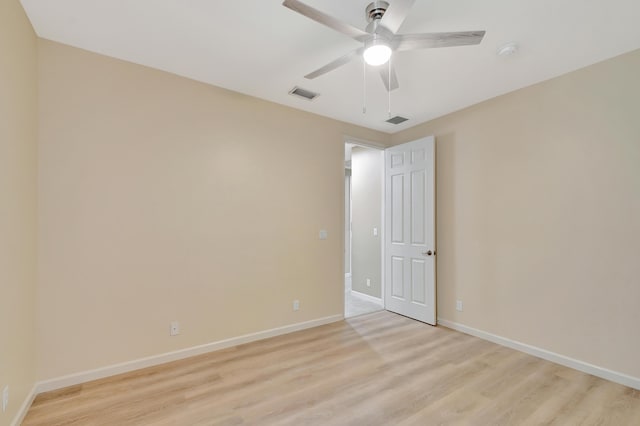 empty room with light hardwood / wood-style floors and ceiling fan