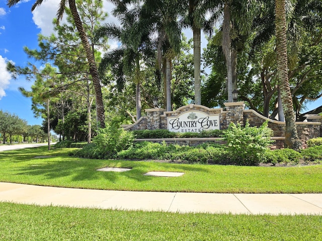 community / neighborhood sign with a lawn