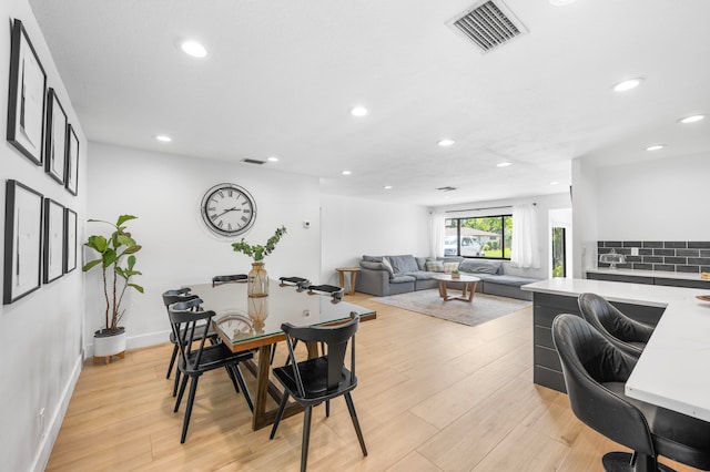 dining room featuring light hardwood / wood-style floors