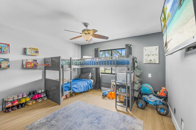 bedroom featuring light hardwood / wood-style floors and ceiling fan