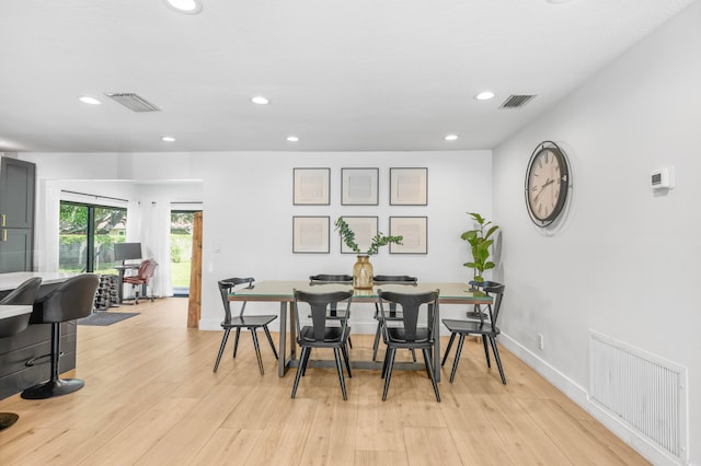 dining space featuring light hardwood / wood-style flooring