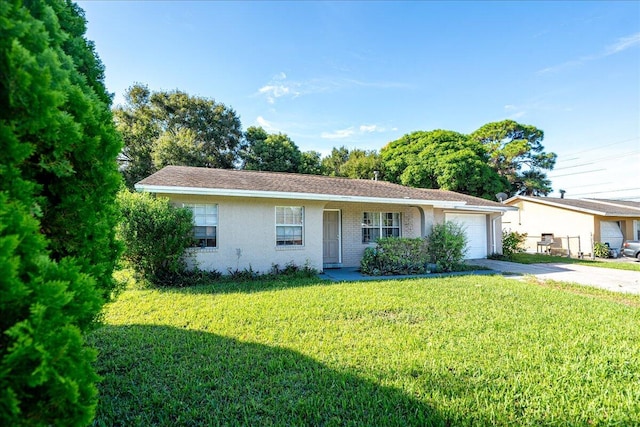 single story home with a garage and a front yard