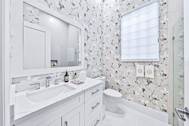 bathroom featuring tile patterned flooring, vanity, toilet, and an enclosed shower