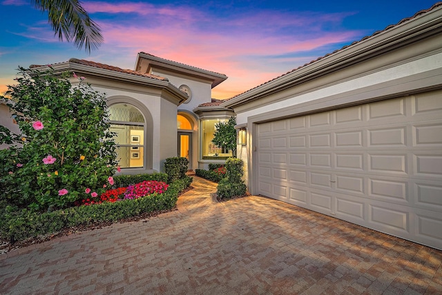 mediterranean / spanish-style home featuring a garage