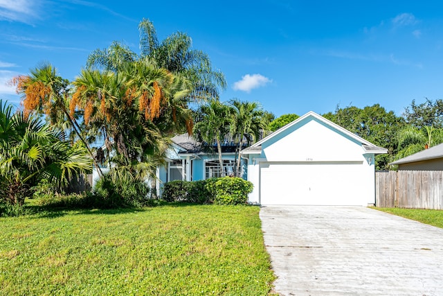 single story home with a garage and a front yard