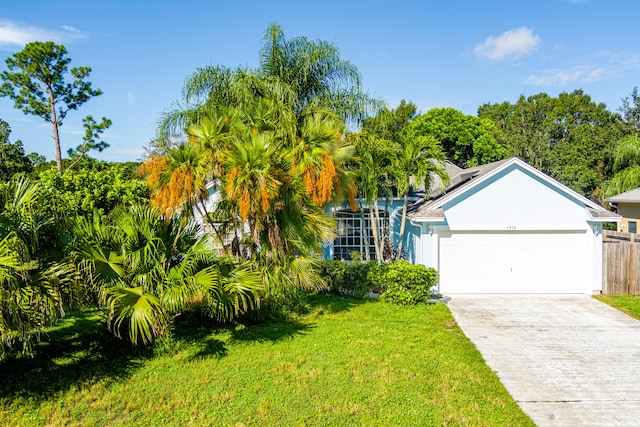 view of front facade featuring a garage and a front yard