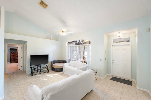 dining room featuring lofted ceiling and light tile patterned floors