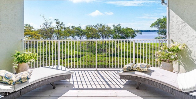 balcony featuring a water view