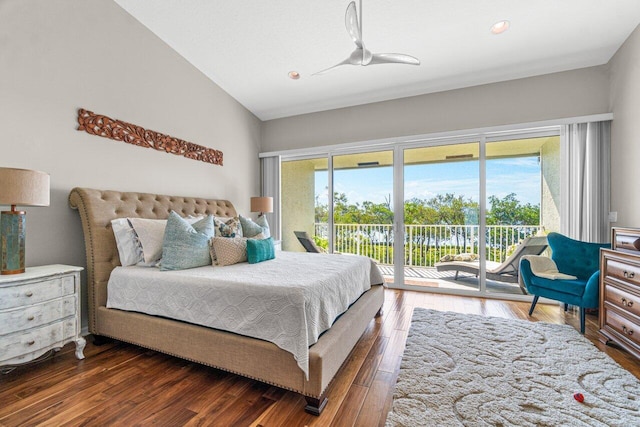 bedroom featuring access to exterior, dark wood-type flooring, ceiling fan, and vaulted ceiling