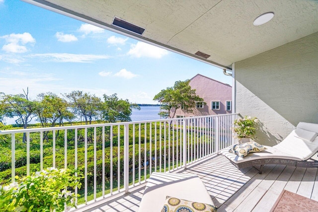 balcony featuring a water view